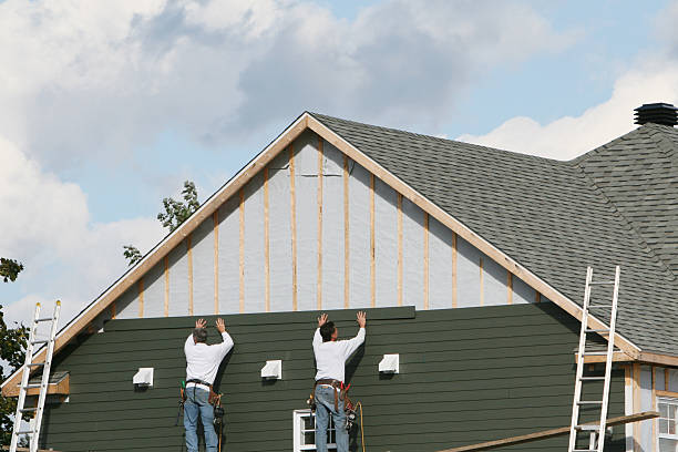 Professional Storm Damage Siding Repair technician working in Lafferty, OH